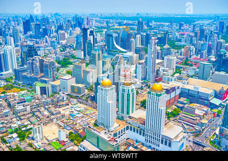 BANGKOK, THAILAND - APRIL 24, 2019: The aerial view on business center of Bangkok with high buildings of offices and modern hotels, on April 24 in Ban Stock Photo