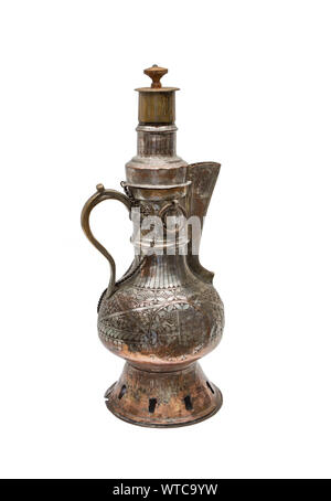 Central Asian kumgan of the 19th century made of hammered brass decorated with elaborate engraving. Stock Photo