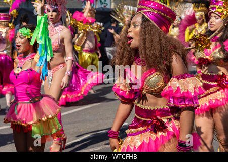 Parade goers performing at Notting Hill Carnival on Monday 26th August 2019 Stock Photo