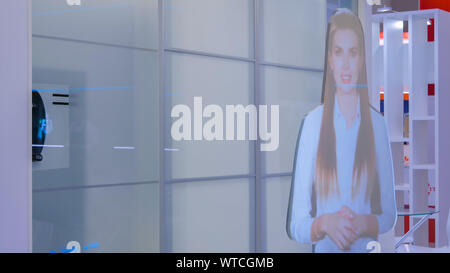 Interactive virtual promoter hologram mannequin: advanced digital display Stock Photo