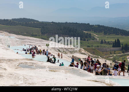 travertines of Pamukkale - Cotton Castle - Cotton Palace Turkey with beautiful blue colors and reflections on water pools Stock Photo