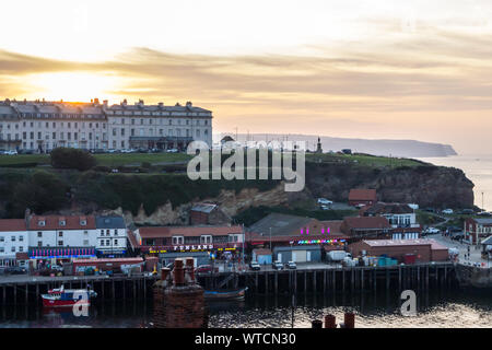 Sunset at Whitby West Cliff at Whitby, North Yorkshire Stock Photo