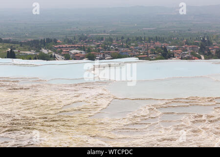 travertines of Pamukkale - Cotton Castle - Cotton Palace Turkey with beautiful blue colors and reflections on water pools Stock Photo