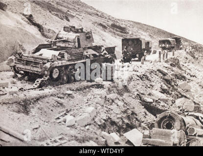 WWII period. Fighting in Cyrenaica. The successive advances and retreats of the opponents let the roads strewn with destroyed material. Stock Photo