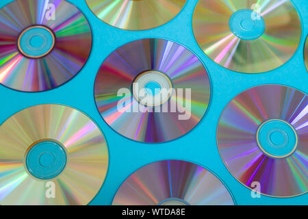 Vintage CD or DVD disk background, old circle discs used for data storage, share movies and music Stock Photo