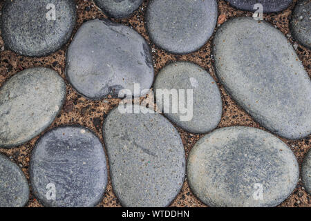 Grey beach round pebbles floor Stock Photo