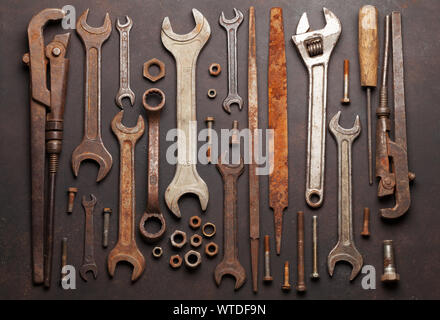 Vintage old tools on stone backdrop. Top view closeup. Flat lay Stock Photo