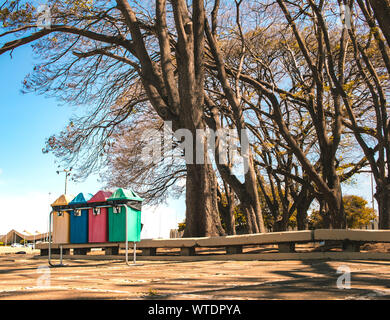 Photo of bins for selective collection in a square. Stock Photo