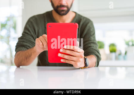 Close up of man using touchpad tablet Stock Photo