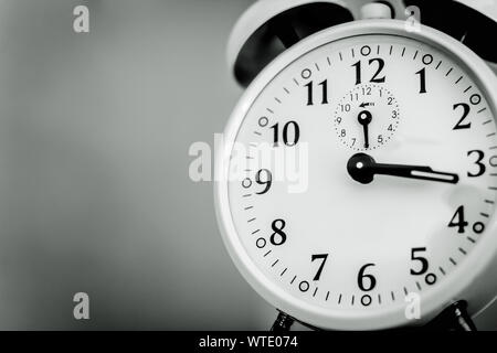 Photo of a retro alarm clock in black and white. Stock Photo