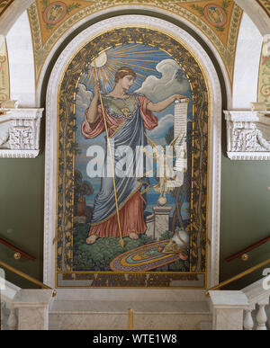 Second Floor, East Corridor. Mosaic of Minerva by Elihu Vedder within central arched panel leading to the Visitor's Gallery. Library of Congress Thomas Jefferson Building, Washington, D.C. Exhibit caption: Pictured on this mosaic in the arched panel is the Roman Goddess Minerva--guardian of civilization. She is portrayed as the Minerva of Peace, but according to the artist who created her, Elihu Vedder (American painter, 1836–1923), the peace and prosperity that she enjoys was attained only through warfare. A little statue of Nike, a representation of Victory, similar to those erected by ancie Stock Photo