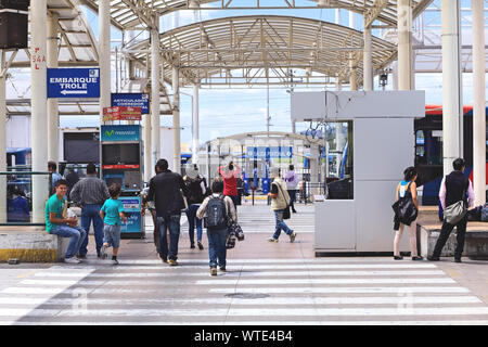 QUITO, ECUADOR - AUGUST 8, 2014: Unidentified people walking to the boarding area of the local transportation system at Quitumbe in Quito, Ecuador Stock Photo