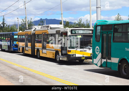 QUITO, ECUADOR - AUGUST 8, 2014: Trolleybus of the local public transportation system standing outside the Quitumbe Terminal Terrestre in Quito Stock Photo