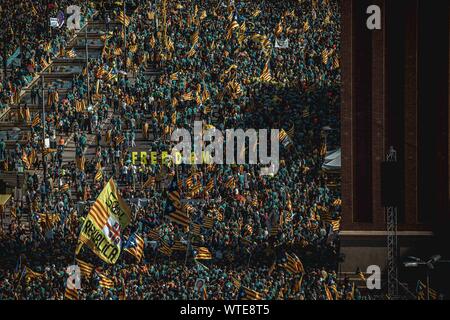 Barcelona, Spain. 11th Sep, 2019. The word 'Freedom' is formed as pro-independence Catalans fill Barcelona's Plaza Espanya to claim the independence on Catalonia's national day, 'La Diada' Credit: Matthias Oesterle/Alamy Live News Stock Photo