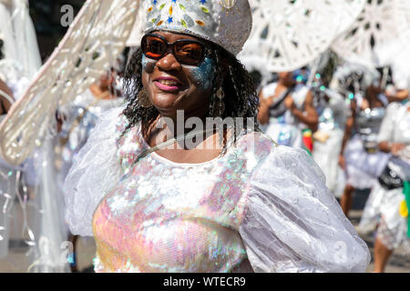 A parade goer performing at Notting Hill Carnival in August 2019 Stock Photo