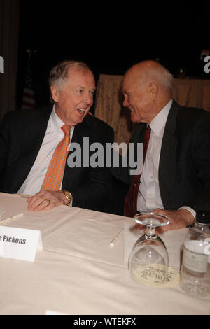 ***FILE PHOTO*** T. Boone Pickens Has Passed Away at 91. T Boone Pickens and John Glenn at a press conference for the Annual National Football Foundation Awards at the Waldorf Astoria, New York City. December 9, 2008. Credit: Dennis Van Tine/MediaPunch Stock Photo