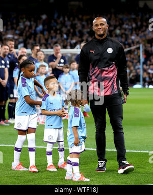 Manchester City Legend's and Premier League All Stars XI players hold up a  banner for the Tackle4MCR campaign prior to the beginning of the Vincent  Kompany Testimonial at the Etihad Stadium, Manchester
