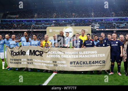 Manchester City Legend's and Premier League All Stars XI players hold up a  banner for the Tackle4MCR campaign prior to the beginning of the Vincent  Kompany Testimonial at the Etihad Stadium, Manchester