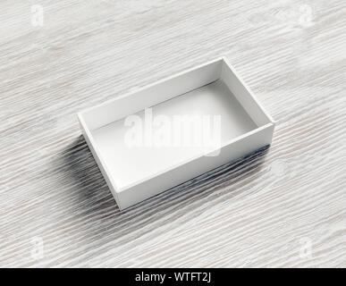 Blank white paper opened box on light wooden background. Stock Photo