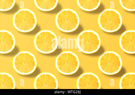 Vivid fruit pattern of fresh lemon on colourful background Stock Photo