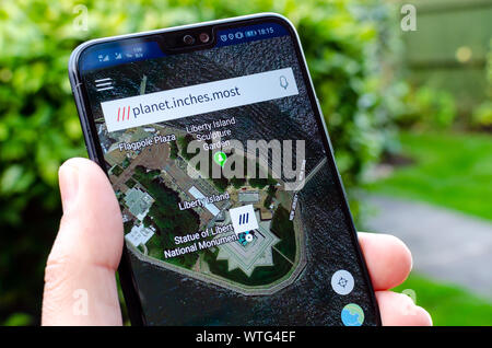 Three Word Grid Reference What3Words App On The Screen, Showing As An Example The "Three Word"  Coordinates For The Famous Landmark Statue Of Liberty In New York Stock  Photo - Alamy