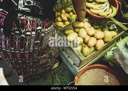 Woman Shopping for Fruit at Market in San Pedro la Laguna, Guatemala