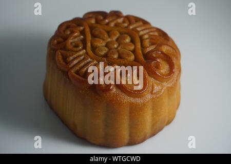 Double egg yolk and lotus seed paste moon cakes for Mid-Autumn Festival celebrated in Chinese culture. Stock Photo