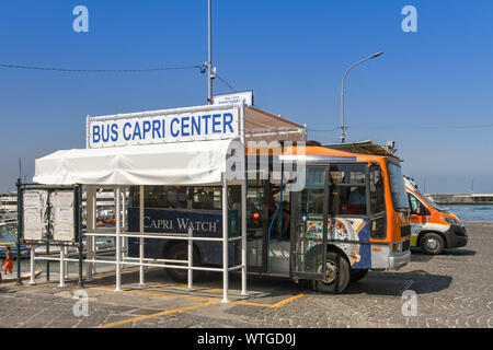 ISLE OF CAPRI, ITALY - AUGUST 2019: Bus parked at a bus stop in the port on the Isle of Capri. Small buses are used on the island due to narrow roads Stock Photo