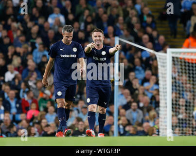 Manchester, UK. 11th Sep, 2019. Vincent Kompany Testimonial, Manchester City Legends versus Premier League All Stars XI; Robbie Keane of the Premier League All Stars XI celebrates with Robin van Persie after he levelled the score at 1-1 - Editorial Use Only. Credit: Action Plus Sports Images/Alamy Live News Stock Photo