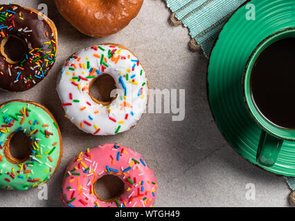 Delicous group of donuts with cup of coffee Stock Photo