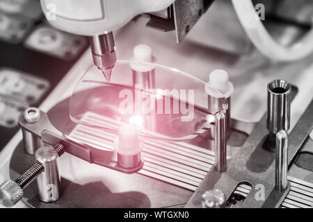 Lens manufacturing in modern laboratory. Stock Photo