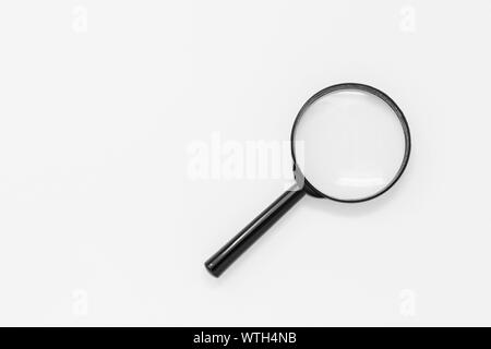 Magnifying glass isolated on a white background, with space for copy Stock Photo