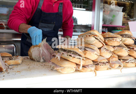 lots of sandwiches stuffed with roast pork for sale in the street food stall Stock Photo