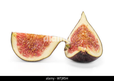 Group of two slices of fresh fig fruit isolated on white background Stock Photo