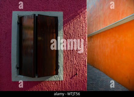 Brown window with a beam of light illuminating the wall Stock Photo