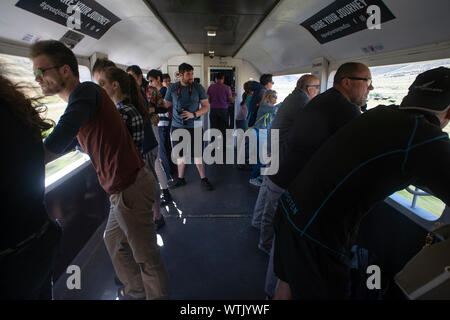 Picture by Tim Cuff - 5 January 2019 - Tranz Alpine train journey from Christchurch to Greymouth, New Zealand: in the open-air viewing carriage Stock Photo