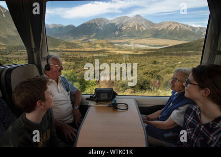 Picture by Tim Cuff - 4 January 2019 - Tranz Alpine train journey from Greymouth to Christchurch, New Zealand: two children and their grandparents enj Stock Photo