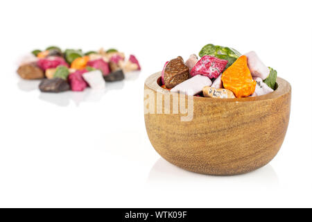 Lot of whole sweet chocolate stone small group is in the back and the rest is in the front isolated on white background Stock Photo