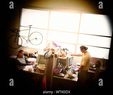 Two men engrossed in their work at office. Stock Photo