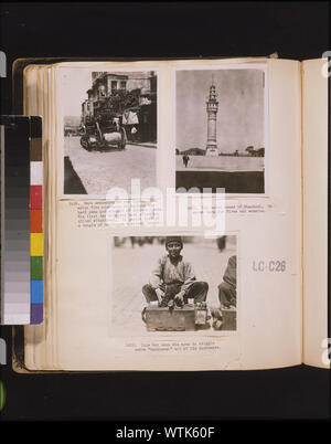 More  awakening of the Turks. New motor fire apparatus to replace the hand pump and runners of ancient times. The first day this was used after the Allied withdrawal, it passed through a couple of houses on a street corner  Photographs show a fire truck in the street, a watchtower and a shoe shine boy with box, Istanbul,Turkey. Stock Photo