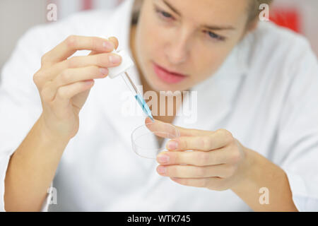 using a pipette for pcr processing in microbiological laboratory Stock Photo