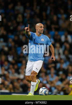 Manchester City Legend's and Premier League All Stars XI players hold up a  banner for the Tackle4MCR campaign prior to the beginning of the Vincent  Kompany Testimonial at the Etihad Stadium, Manchester