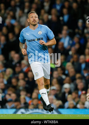 Manchester City Legend's and Premier League All Stars XI players hold up a  banner for the Tackle4MCR campaign prior to the beginning of the Vincent  Kompany Testimonial at the Etihad Stadium, Manchester