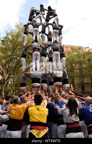 Barcelona, Spain. 11th Sep, 2019. ‘Castelliers' compete on Calle Bruc to make the highest human tower in central Barcelona on Catalan national day. Credit: Rod Harbinson/ZUMA Wire/Alamy Live News Stock Photo