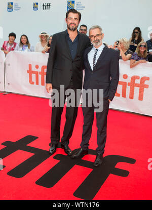 Toronto, Canada. 11th Sep, 2019. Director Giuseppe Capotondi (R) and actor Claes Bang pose for photos before the North American premiere of the film 'The Burnt Orange Heresy' at Roy Thomson Hall during the 2019 Toronto International Film Festival (TIFF) in Toronto, Canada, on Sept. 11, 2019. Credit: Zou Zheng/Xinhua Stock Photo