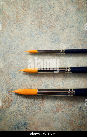 Paintbrushes on a table. Stock Photo