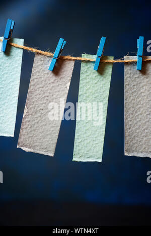 Watercolor test cards hanging on a rope. Stock Photo