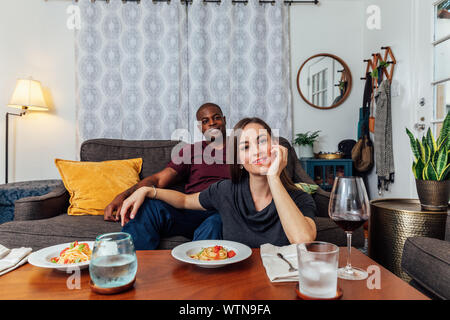 Couple having dinner and watching tv. Stock Photo