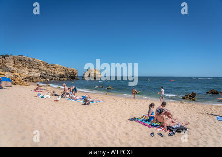 June 28th 2019 - Algarve, Portugal - Families having fun a nice beach in southern Portugal in Algarve Stock Photo