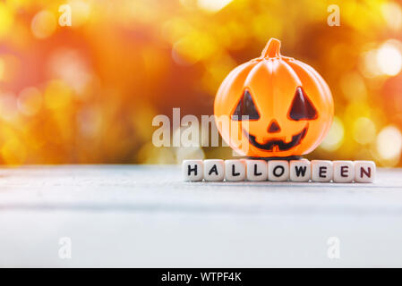 Halloween background decorated holidays festive concept / funny faces jack o lantern pumpkin halloween decorations for party accessories object  on wo Stock Photo
